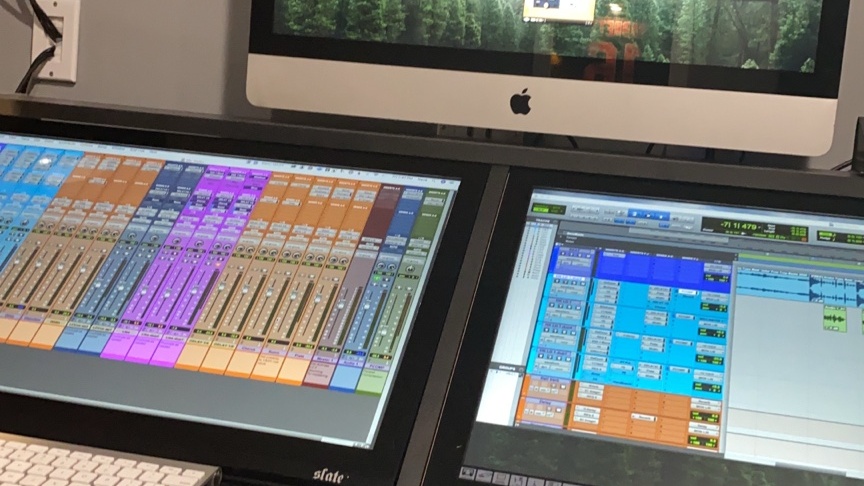 Neva in the studio working on beats